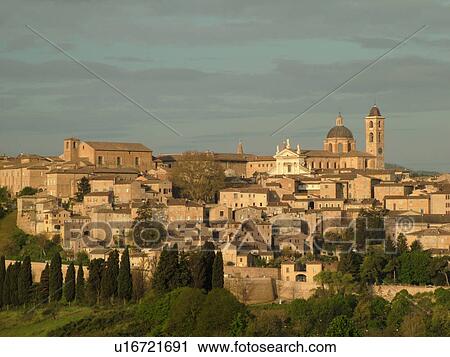 Stock Image -  Marche, Italy, Urbino, Europe, Scenic view of the medieval hill town of Urbino.. Fotosearch