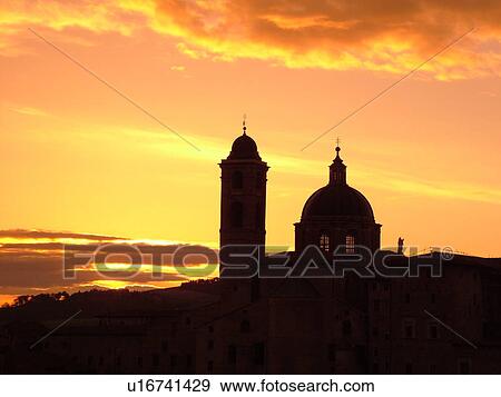 Marche, Italy, Urbino, Europe, Silhouette of the Palazzo Ducale in the medieval hill town of Urbino at sunrise. View Large Photo Image Stock Photo - Marche, Italy, Urbino, Europe, Silhouette of the Palazzo Ducale in the medieval hill town of Urbino at sunrise.. Fotosearch