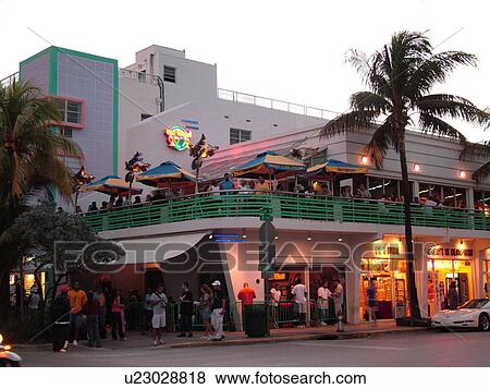 Stock Photo -  Miami Beach, South Beach, FL, Florida, Ocean Drive, American Riviera, Art Deco District, restaurant, evening. Fotosearch