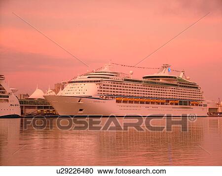 Stock Image -  Miami, FL, Florida, Biscayne Bay, Port of Miami, Dodge Island, cruise ship, sunset. Fotosearch