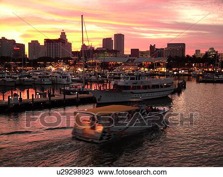 Stock Image -  Miami, FL, Florida, Biscayne Bay, Bayside Marketplace, Miamarina, sunset, skyline. Fotosearch
