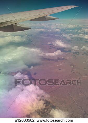 Mid-West, Aerial, clouds, wing, airplane flying over the Midwest View Large Photo Image Stock Image - Mid-West, Aerial, clouds, wing, airplane flying over the Midwest. Fotosearch