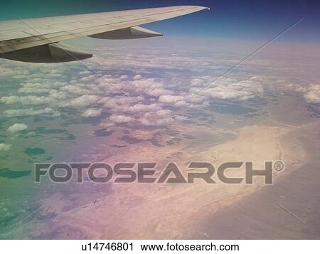 Mid-West, Aerial, clouds, wing, airplane flying over the Midwest View Large Photo Image Stock Image - Mid-West, Aerial, clouds, wing, airplane flying over the Midwest. Fotosearch