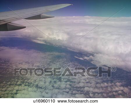 Mid-West, Aerial, clouds, wing, airplane flying over the Midwest View Large Photo Image Stock Image - Mid-West, Aerial, clouds, wing, airplane flying over the Midwest. Fotosearch