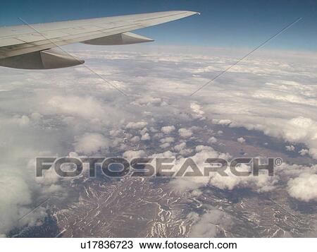 Mid-West, Aerial, clouds, wing, airplane flying over the Midwest View Large Photo Image Stock Image - Mid-West, Aerial, clouds, wing, airplane flying over the Midwest. Fotosearch