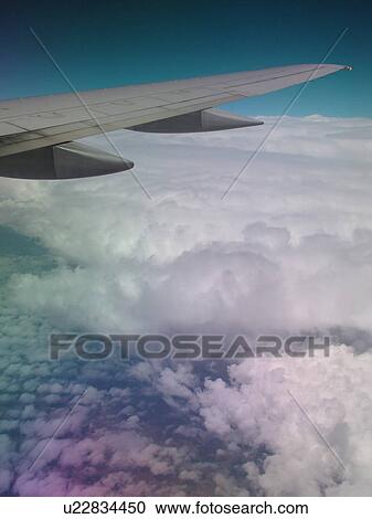 Mid-West, Aerial, clouds, wing, airplane flying over the Midwest View Large Photo Image Stock Image - Mid-West, Aerial, clouds, wing, airplane flying over the Midwest. Fotosearch