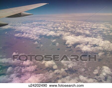 Mid-West, Aerial, clouds, wing, airplane flying over the Midwest View Large Photo Image Stock Image - Mid-West, Aerial, clouds, wing, airplane flying over the Midwest. Fotosearch