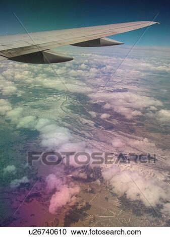 Mid-West, Aerial, clouds, wing, airplane flying over the Midwest View Large Photo Image Stock Image - Mid-West, Aerial, clouds, wing, airplane flying over the Midwest. Fotosearch