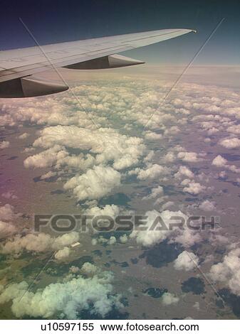 Mid-West, Aerial, clouds, wing, airplane flying over the Midwest View Large Photo Image Stock Photography - Mid-West, Aerial, clouds, wing, airplane flying over the Midwest. Fotosearch