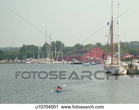 Stock Image -  Mystic, CT, Connecticut, Atlantic Ocean, Mystic Seaport, kayaking. Fotosearch