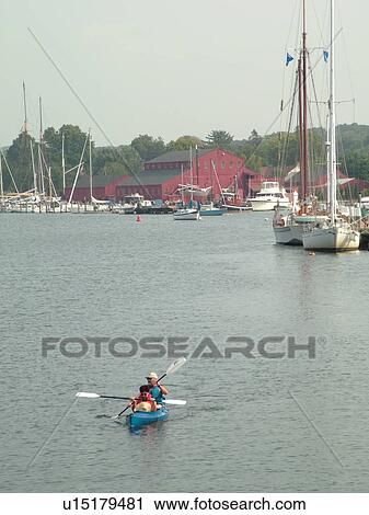Stock Image -  Mystic, CT, Connecticut, Atlantic Ocean, Mystic Seaport, kayaking. Fotosearch