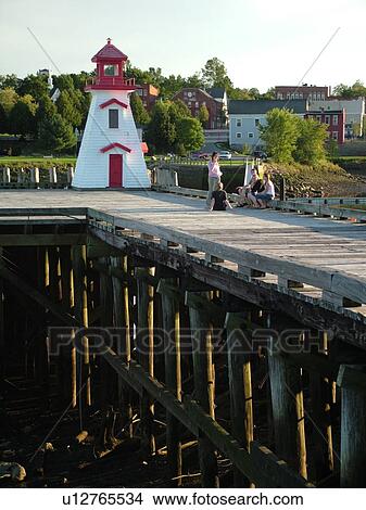 Picture -  New Brunswick, Canada, St. Stephens, St. Croix River, Lighthouse along the Saint Croix River at low tide.. Fotosearch