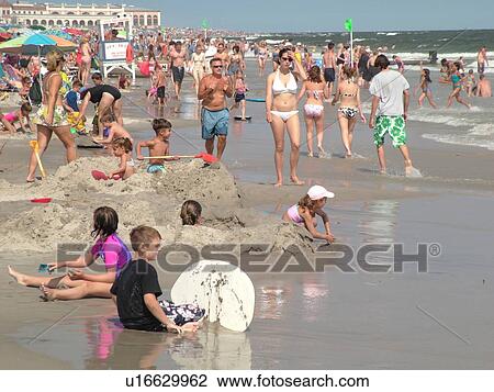 Ocean City, NJ, New Jersey, Atlantic Ocean, shore, beach, children playing in the sand View Large Photo Image Stock Image - Ocean City, NJ, New Jersey, Atlantic Ocean, shore, beach, children playing in the sand. Fotosearch