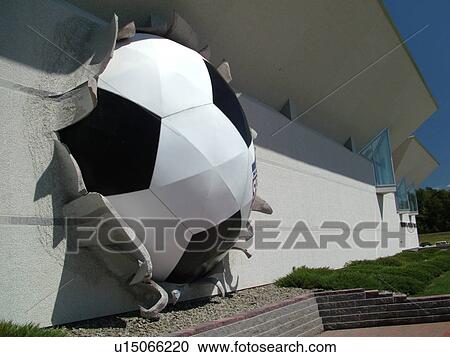 Stock Image -  Oneonta, NY, New York, National Soccer Hall of Fame, giant soccer ball in wall. Fotosearch