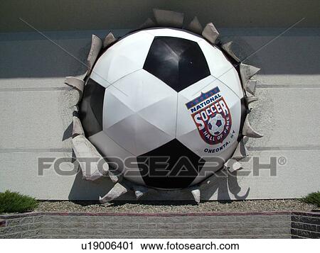 Stock Image -  Oneonta, NY, New York, National Soccer Hall of Fame, giant soccer ball in wall. Fotosearch