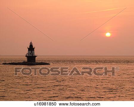 Stock Image -  Orient, NY, Long Island, New York, Long Island Sound, Orient Lighthouse, sunset. Fotosearch