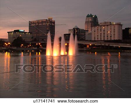 Orlando, FL, Florida, Downtown skyline, Lake Lucerne, illuminated fountain, evening View Large Photo Image Stock Image - Orlando, FL, Florida, Downtown skyline, Lake Lucerne, illuminated fountain, evening. Fotosearch