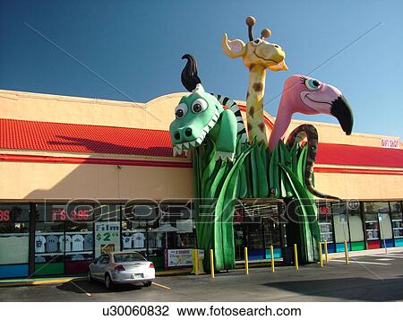 Orlando, FL, Florida, gift shop, Disney souvenirs, giant dragon, giraffe, flamingo heads View Large Photo Image Stock Image - Orlando, FL, Florida, gift shop, Disney souvenirs, giant dragon, giraffe, flamingo heads. Fotosearch