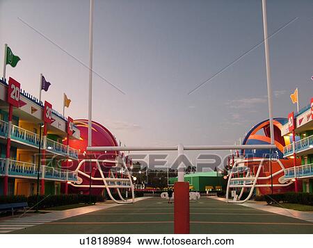 Orlando, FL, Florida, Lake Buena Vista, Disney's All-Star Sports Resort, evening, giant football field and helmets in the courtyard View Large Photo Image Picture - Orlando, FL, Florida, Lake Buena Vista, Disney's All-Star Sports Resort, evening, giant football field and helmets in the courtyard. Fotosearch