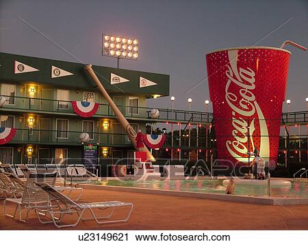 Orlando, FL, Florida, Lake Buena Vista, Disney's All-Star Sports Resort, evening, swimming pool, giant baseballs and bats, red coca-cola cup View Large Photo Image Stock Image - Orlando, FL, Florida, Lake Buena Vista, Disney's All-Star Sports Resort, evening, swimming pool, giant baseballs and bats, red coca-cola cup. Fotosearch