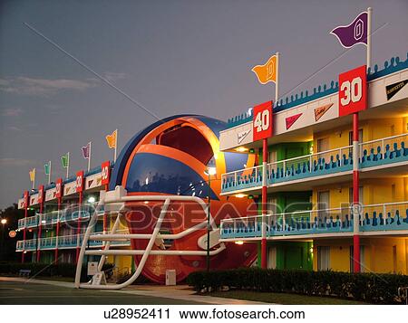 Orlando, FL, Florida, Lake Buena Vista, Disney's All-Star Sports Resort, evening, giant football helmet in the courtyard View Large Photo Image Stock Image - Orlando, FL, Florida, Lake Buena Vista, Disney's All-Star Sports Resort, evening, giant football helmet in the courtyard. Fotosearch