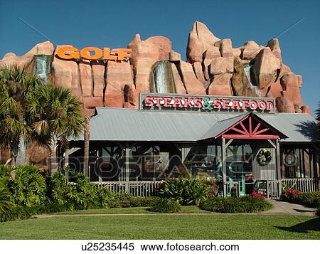 Stock Photography -  Orlando, FL, Florida, Magic Mining Steak and Seafood Company, restaurant, miniature golf. Fotosearch
