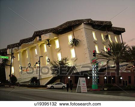Stock Image -  Orlando, FL, Florida, Wonder Works, upside-down buildings, evening. Fotosearch