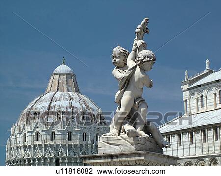 Pisa, Tuscany, Italy, Toscana, Europe, Cupid statue outside the Bapistry and Cathedral in Campo dei Miracoli (Field of Miracles) in the city of Pisa. View Large Photo Image Stock Image -  Pisa, Tuscany, Italy, Toscana, Europe, Cupid statue outside the Bapistry and Cathedral in Campo dei Miracoli (Field of Miracles) in the city of Pisa.. Fotosearch