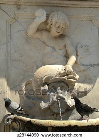 Stock Image -  Pisa, Tuscany, Italy, Toscana, Europe, Pigeons roosting on a fountain in Campo dei Miracoli (Field of Miracles) in the city of Pisa.. Fotosearch