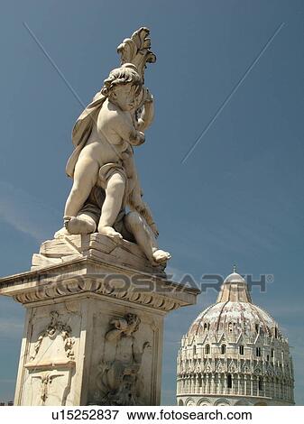 Stock Photo -  Pisa, Tuscany, Italy, Toscana, Europe, Cupid statue outside the Cathedral in Campo dei Miracoli (Field of Miracles) in the city of Pisa.. Fotosearch