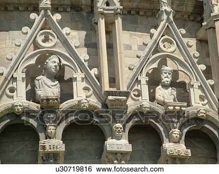 Stock Photograph -  Pisa, Tuscany, Italy, Toscana, Europe, Close-up of the fatade of The Baptistry in Campo dei Miracoli (Field of Miracles) in the city of Pisa.. Fotosearch