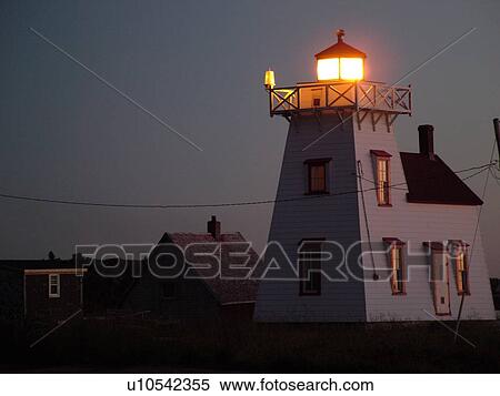 Stock Photography -  Prince Edward Island, North Rusitco, Canada, Queens County, Gulf of Saint Lawrence, North Rustico Harbour Lighthouse, fishing village, evening. Fotosearch
