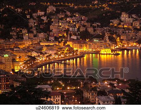 Rapallo, Liguria, Italy, Riviera di Levante, Ligurian Riviera, Europe, Scenic view of the resort town of Rapallo in the evening on the Gulf of Tigullio (Gulfo di Tigullio) along the Ligurian Sea on the Ligurian Riviera. View Large Photo Image Stock Photo - Rapallo, Liguria, Italy, Riviera di Levante, Ligurian Riviera, Europe, Scenic view of the resort town of Rapallo in the evening on the Gulf of Tigullio (Gulfo di Tigullio) along the Ligurian Sea on the Ligurian Riviera.. Fotosearch
