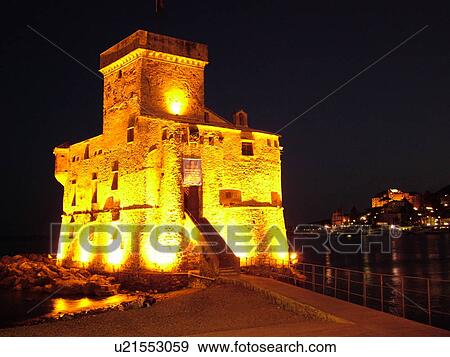 Rapallo, Riviera di Levante, Liguria, Italy, Ligurian Riviera, Europe, The Castle at night on the Gulf of Tigullio (Gulfo di Tigullo) in the resort town of Rapallo along the Ligurian Sea on the Ligurian Riviera. View Large Photo Image Stock Photo - Rapallo, Riviera di Levante, Liguria, Italy, Ligurian Riviera, Europe, The Castle at night on the Gulf of Tigullio (Gulfo di Tigullo) in the resort town of Rapallo along the Ligurian Sea on the Ligurian Riviera.. Fotosearch