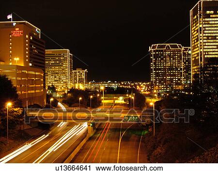 Stock Image -  Richmond, VA, Virginia, downtown skyline, high-rises, evening, Richmond Downtown Expressway, I-95. Fotosearch