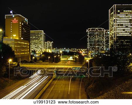 Stock Image -  Richmond, VA, Virginia, downtown skyline, high-rises, evening, Richmond Downtown Expressway, I-95. Fotosearch
