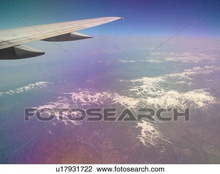 Rocky Mountains, Aerial, wing, airplane flying over the snow-covered Rockies View Large Photo Image Stock Image - Rocky Mountains, Aerial, wing, airplane flying over the snow-covered Rockies. Fotosearch