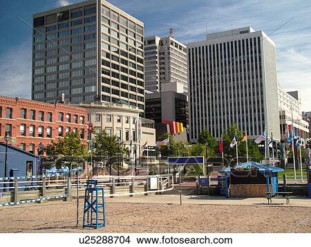 Saint John, Canada, New Brunswick, Beach volleyball courts at Loyalist Plaza and downtown skyline of St. John View Large Photo Image Picture - Saint John, Canada, New Brunswick, Beach volleyball courts at Loyalist Plaza and downtown skyline of St. John. Fotosearch