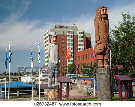 Saint John, New Brunswick, Canada, Totem pole sculptures at Loyalist Plaza in downtown St. John View Large Photo Image Stock Photo - Saint John, New Brunswick, Canada, Totem pole sculptures at Loyalist Plaza in downtown St. John. Fotosearch