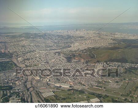 Stock Image -  San Francisco, CA, California, Aerial, airplane flying over Daly City. Fotosearch