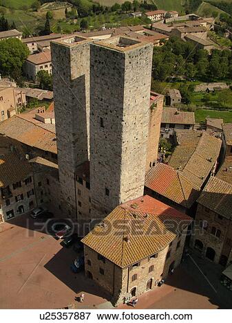 Stock Photo -  San Gimignano, Toscana, Tuscany, Italy, Europe, Aerial view of the rooftops and medieval town of San Gimignano from Torre Grossa.. Fotosearch