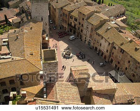 San Gimignano, Tuscany, Italy, Toscana, Europe, Aerial view of the rooftops and medieval town of San Gimignano from Torre Grossa. View Large Photo Image Stock Image - San Gimignano, Tuscany, Italy, Toscana, Europe, Aerial view of the rooftops and medieval town of San Gimignano from Torre Grossa.. Fotosearch