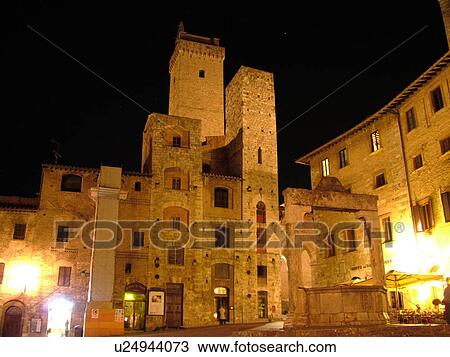 Stock Image -  San Gimignano, Tuscany, Italy, Toscana, Europe, Piazza della Cisterna in the medieval town of San Gimignano in the evening.. Fotosearch