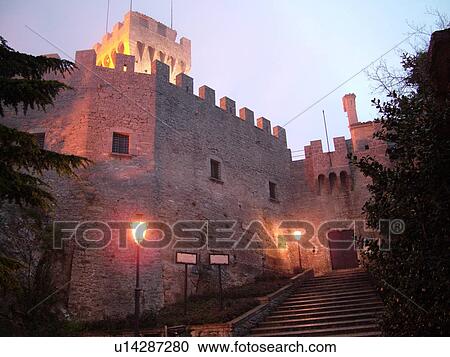 Stock Image -  San Marino, Italy, Europe, Republic of San Marino, Guaita Rocca and Rock Tower on a foggy night in the hilly city-state of San Marino.. Fotosearch