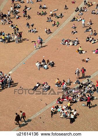 Stock Photograph -  Siena, Italy, Tuscany, Toscana, Europe, Aerial view of people in the Piazza del Campo in the city of Siena from Torre del Mangia.. Fotosearch