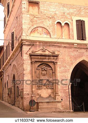 Stock Image -  Spello, Italy, Umbria, Europe, Palazzo Comunale in the Piazza della Repubblica in the medieval town of Spello.. Fotosearch