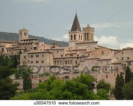 Stock Image -  Spello, Italy, Umbria, Europe, Scenic view of the medieval hill town of Spello.. Fotosearch