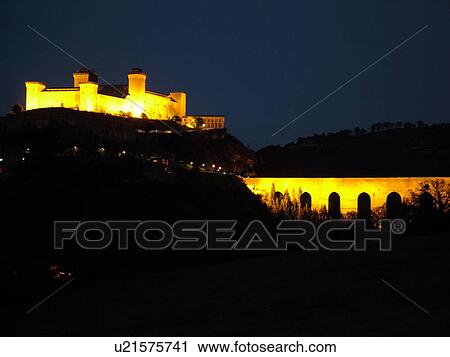 Stock Image -  Spoleto, Italy, Umbria, Europe, Ponte delle Torri (Bridge of the Towers) and Rocca (castle) Albornoziana illuminated at night in the medieval city of Spoleto.. Fotosearch