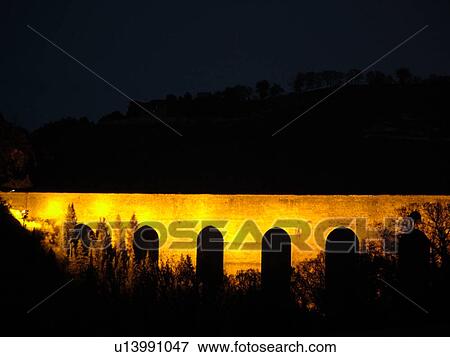 Spoleto, Italy, Umbria, Europe, Ponte delle Torri (Bridge of the Towers) illuminated at night in the medieval city of Spoleto. View Large Photo Image Stock Photo - Spoleto, Italy, Umbria, Europe, Ponte delle Torri (Bridge of the Towers) illuminated at night in the medieval city of Spoleto.. Fotosearch