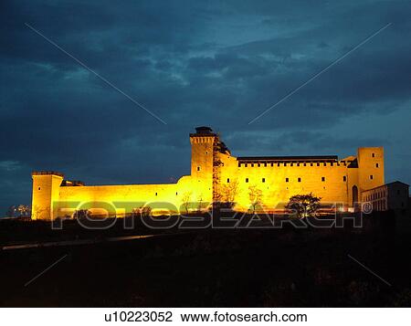 Stock Image -  Spoleto, Italy, Umbria, Europe, Rocca (castle) Albornoziana illuminated at night in the medieval city of Spoleto.. Fotosearch